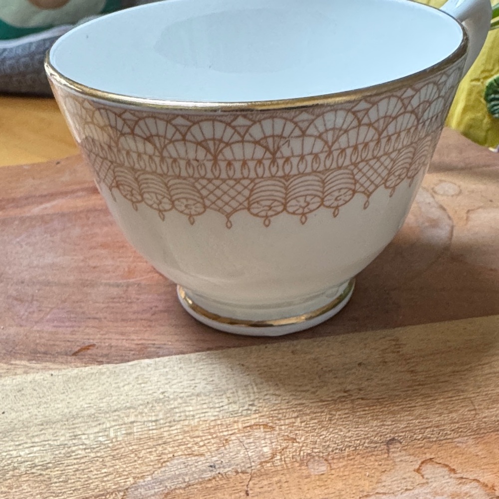 Elegant White and Brown Patterned Teacup